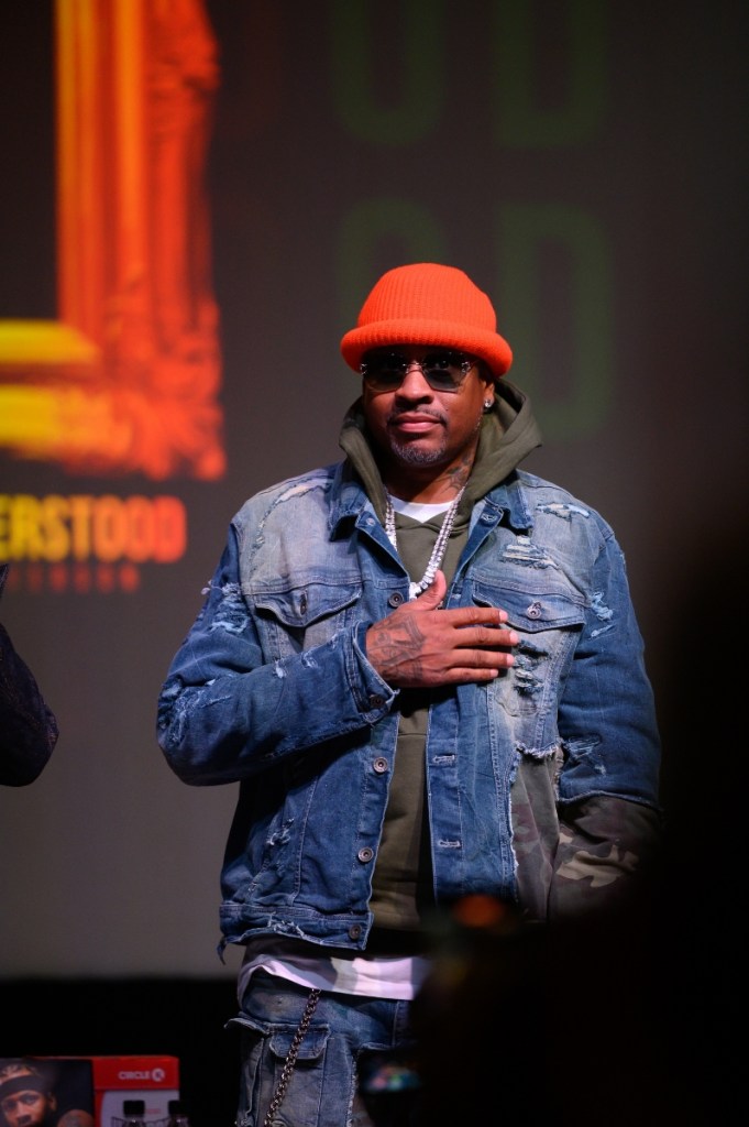 Allen Iverson places his hand over his chest while speaking onstage at the Buckhead Theatre in Atlanta.