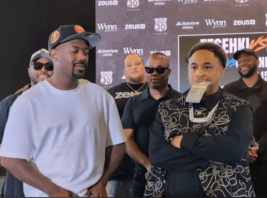 Ray J and Orlando Brown stand face-to-face during the Claressa Shields vs. Kaye Scott opening press conference at State Farm Arena in Atlanta as security and event staff look on.