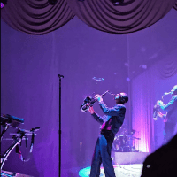 Masego plays saxophone onstage during the Fix Your Face Tour at Nashville’s Ryman Auditorium.